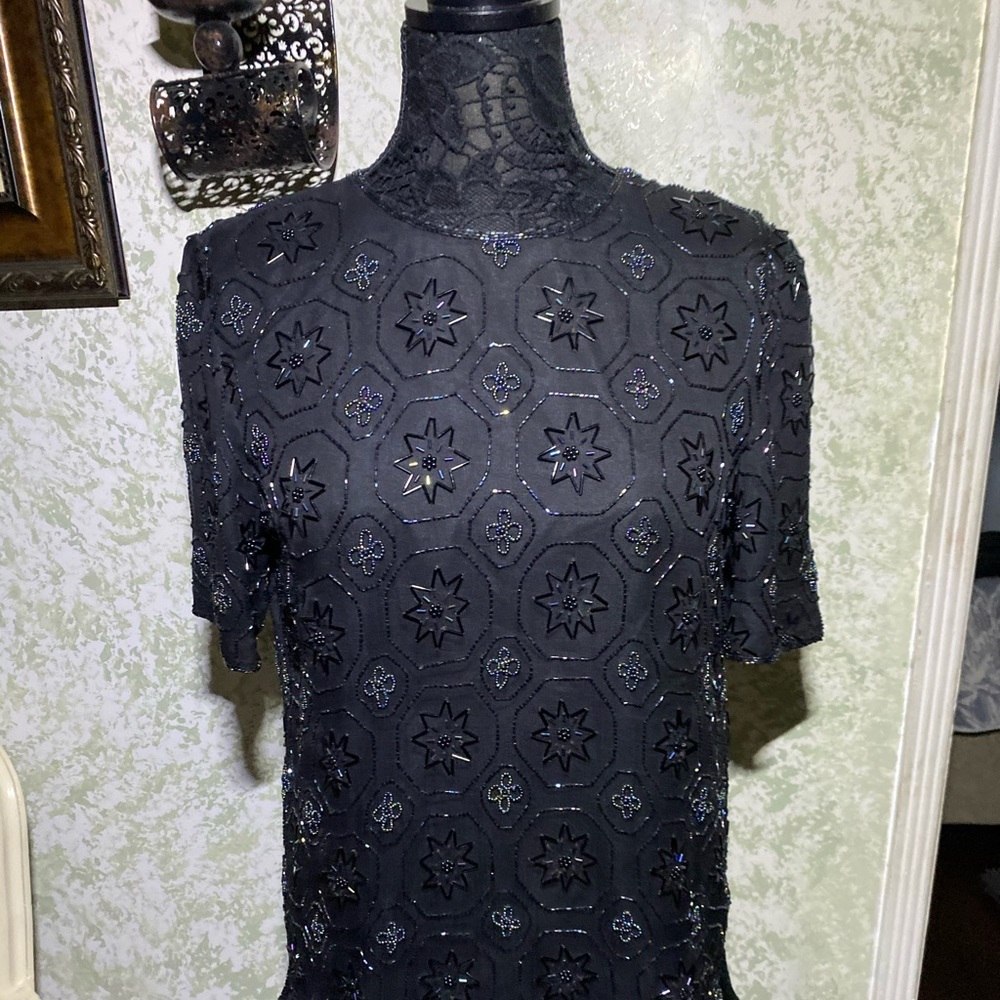 Glittering sequins completely cover  top